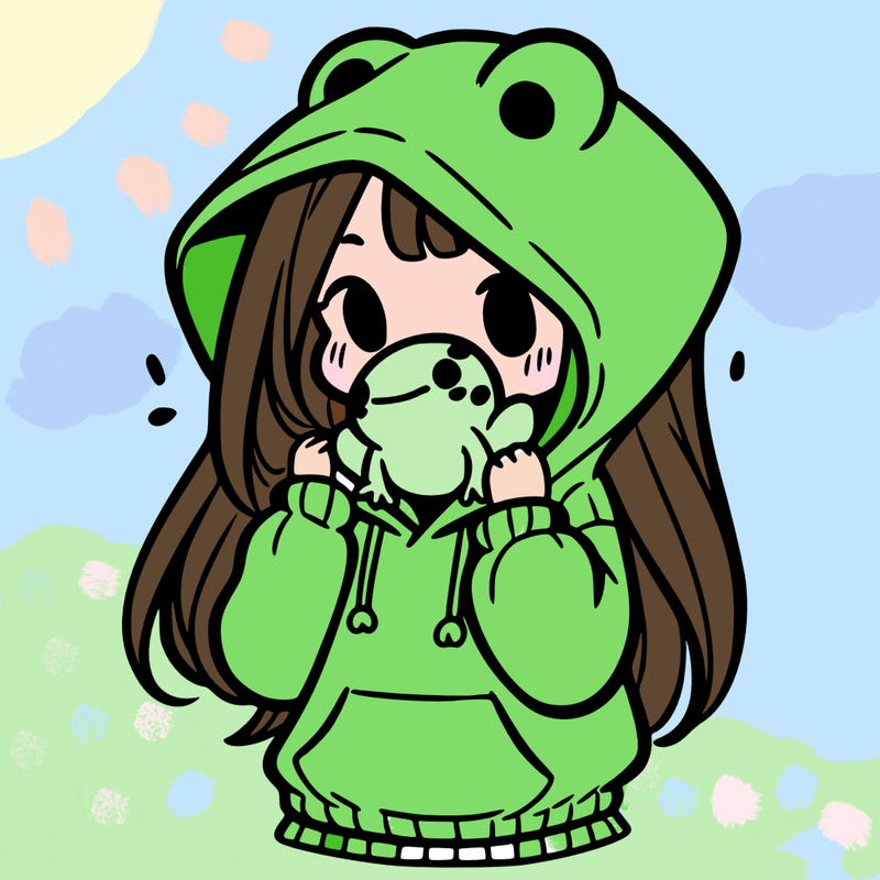 a girl holding a froggy hoodie