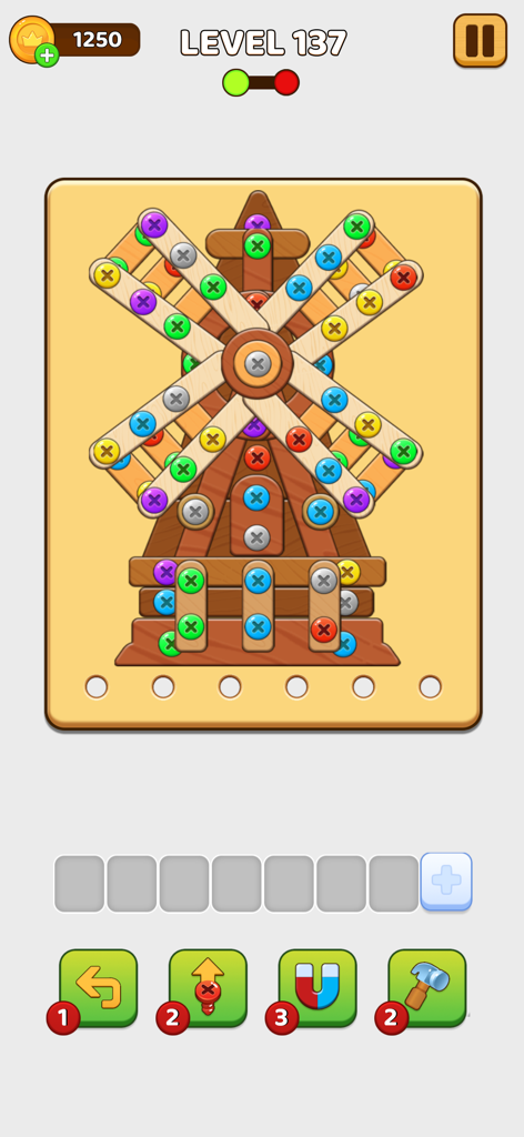 Une capture d'écran du gameplay de Screw Color Nuts Match Master montrant un puzzle de moulin à vent en bois avec des vis colorées