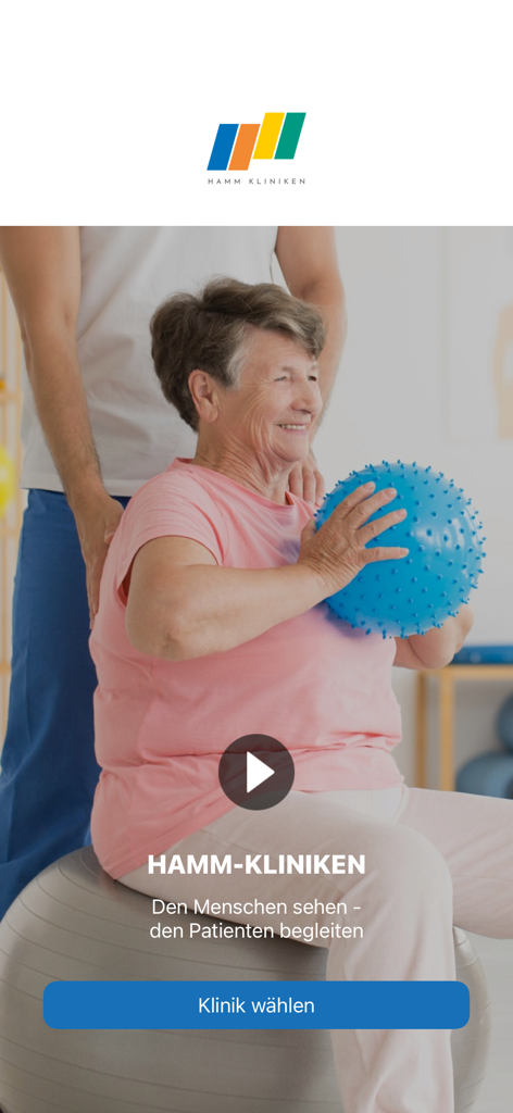 Hamm Kliniken - Écran d'accueil de l'application Hamm Kliniken montrant une femme âgée faisant de l'exercice avec un thérapeute