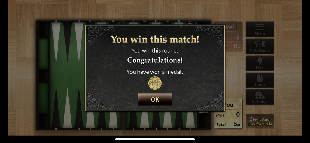 The Backgammon - 승리 메시지와 금메달 획득 아이콘을 보여주는 백개먼 앱의 승리 화면
