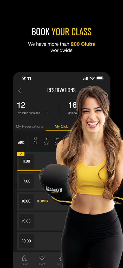 Brooklyn Fitboxing - A smiling woman in boxing gloves standing next to the Brooklyn Fitboxing app reservation screen