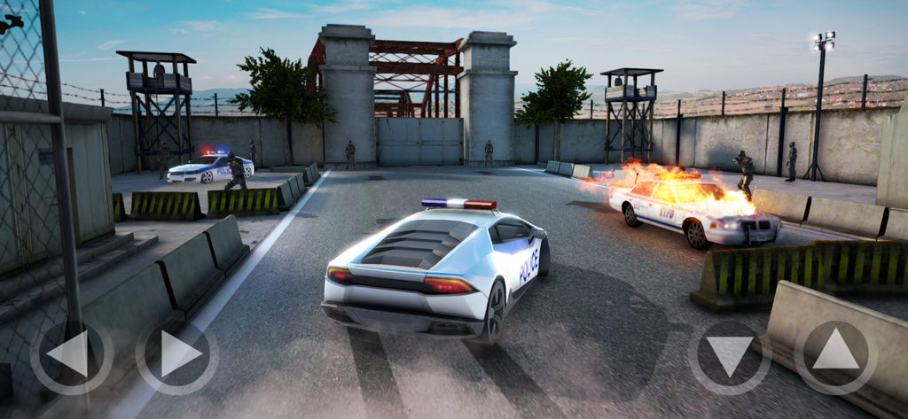 Action gameplay screenshot showing a police sports car and a burning vehicle near a prison gate