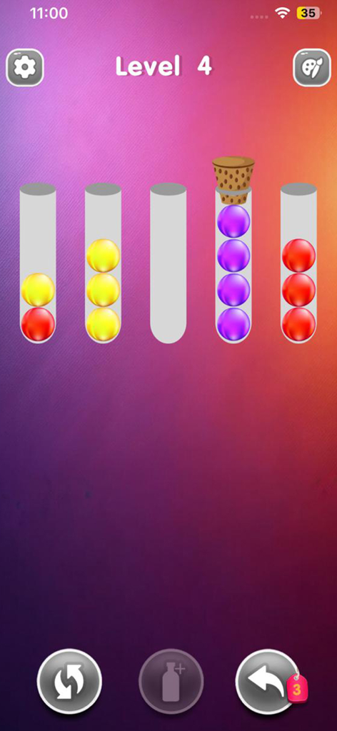 Ball Sort : Puzzle Color Game - A mobile screen showing color sorting gameplay with colored balls in glass tubes for a logic puzzle.