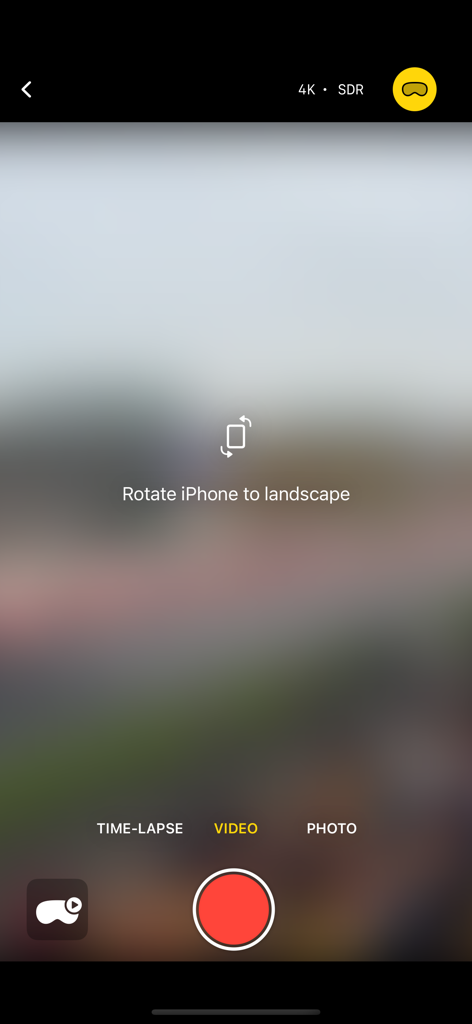 SpatialCamera - SpatialCameraアプリの録画画面。空間ビデオキャプチャのためにデバイスを横向きに回転するように促すプロンプトが表示されます。