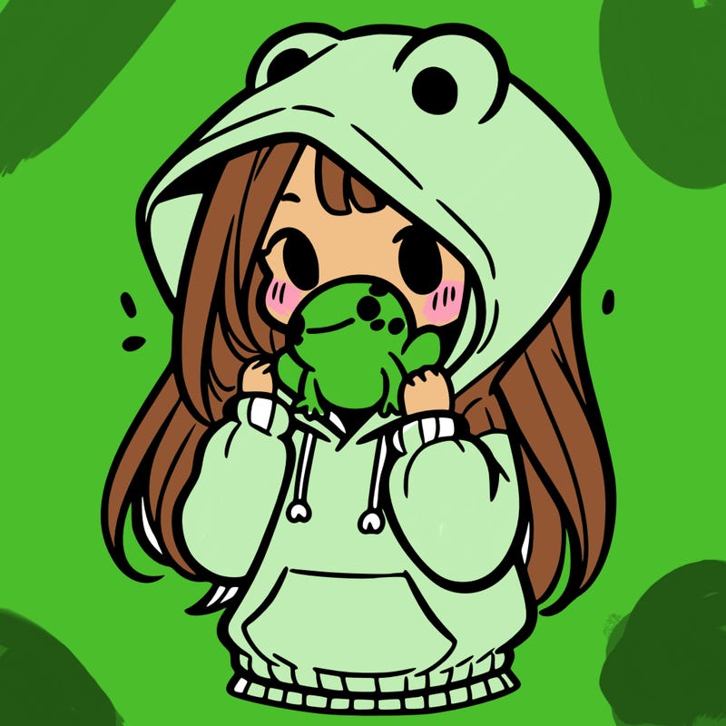a girl holding a froggy hoodie