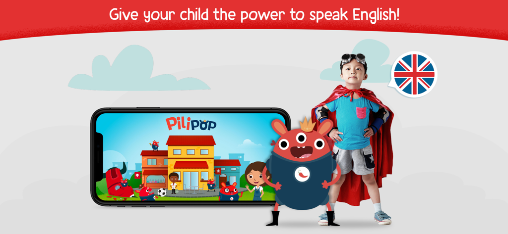 Un niño pequeño con un disfraz de superhéroe junto a un teléfono que muestra la aplicación de aprendizaje de inglés Pili Pop.