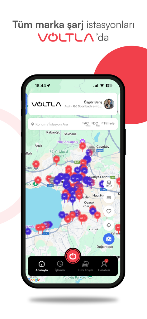 A smartphone displaying the Voltla app map with numerous electric vehicle charging station markers.