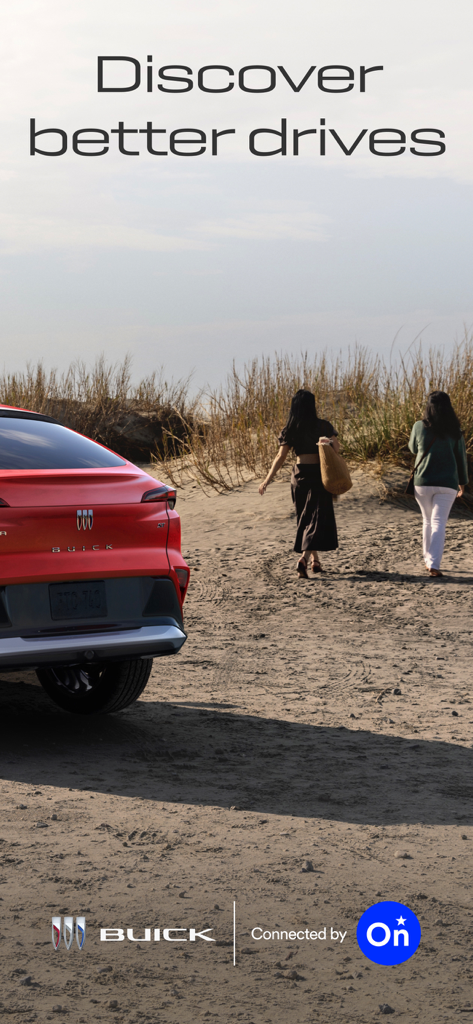 myBuick - A red Buick SUV parked on a sandy beach with two women walking towards dunes and the text Discover better drives.