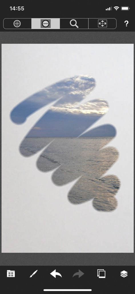 PicMix Lite - Una pincelada manual revelando una foto de paisaje marino en PicMix Lite