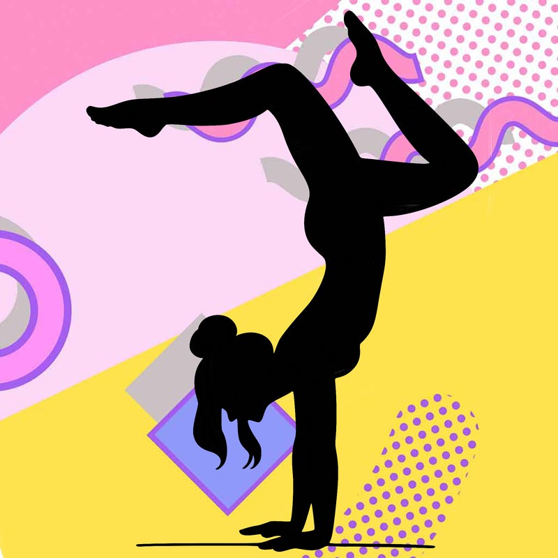 a woman doing a handstand