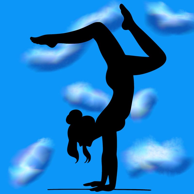 a woman doing a handstand