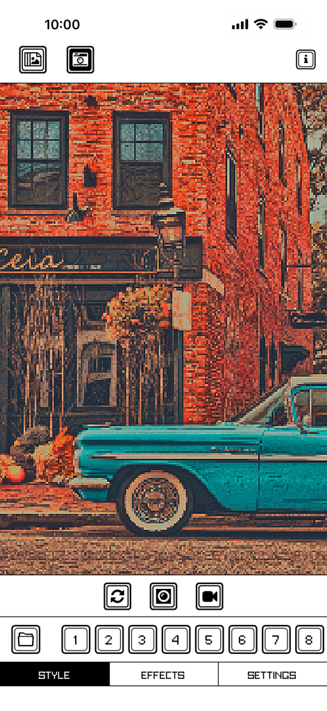 Interfaz de la aplicación Pixel Art Camera que muestra un coche azul vintage pixelado y un edificio de ladrillos