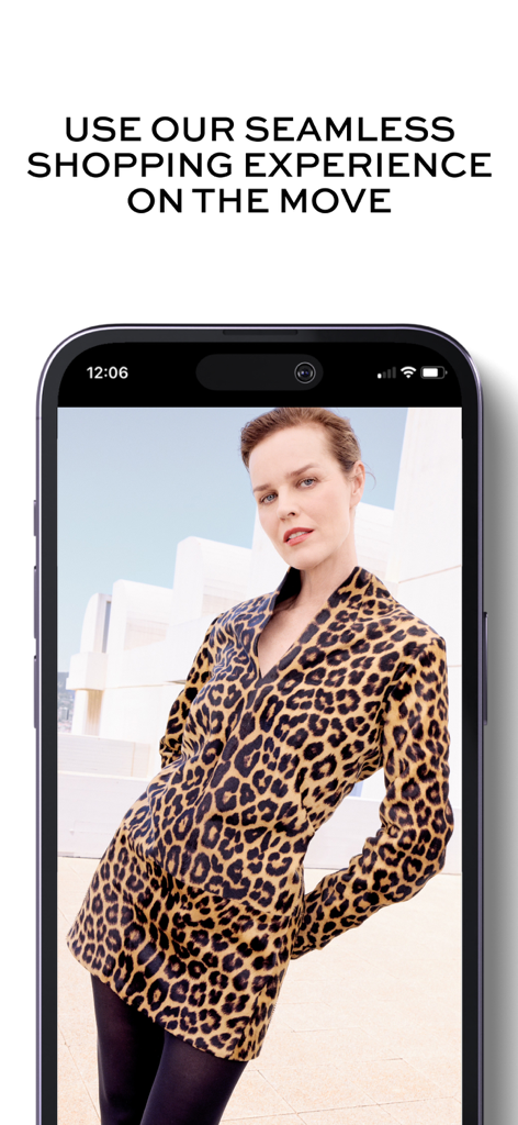 Smartphone screen displaying the NET-A-PORTER app featuring a model in a leopard print outfit with text about seamless shopping on the move
