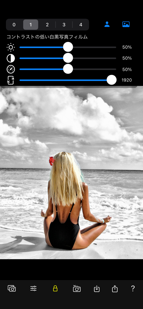 Color Focus Lens - Selective color photo of a woman on a beach with a black and white background in the app interface