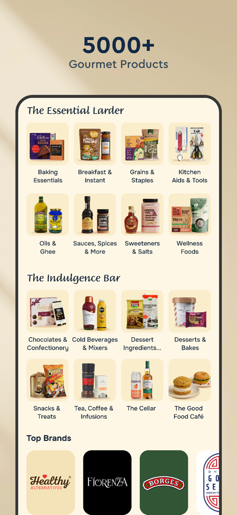 The Essential Larder 및 The Indulgence Bar를 포함한 고메 식품 카테고리와 주요 브랜드 로고가 표시된 Nature's Basket 앱 인터페이스