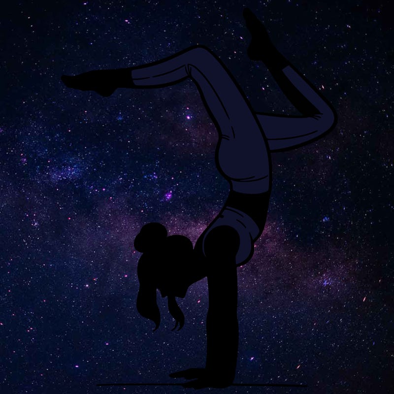 a woman doing a handstand