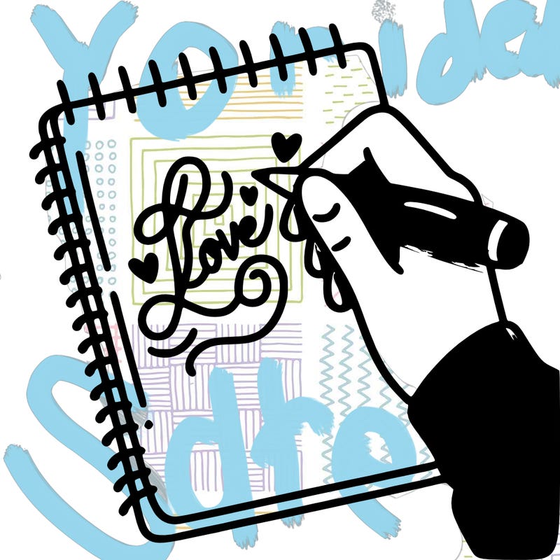 a hand writing “love” in calligraphy on a notebook