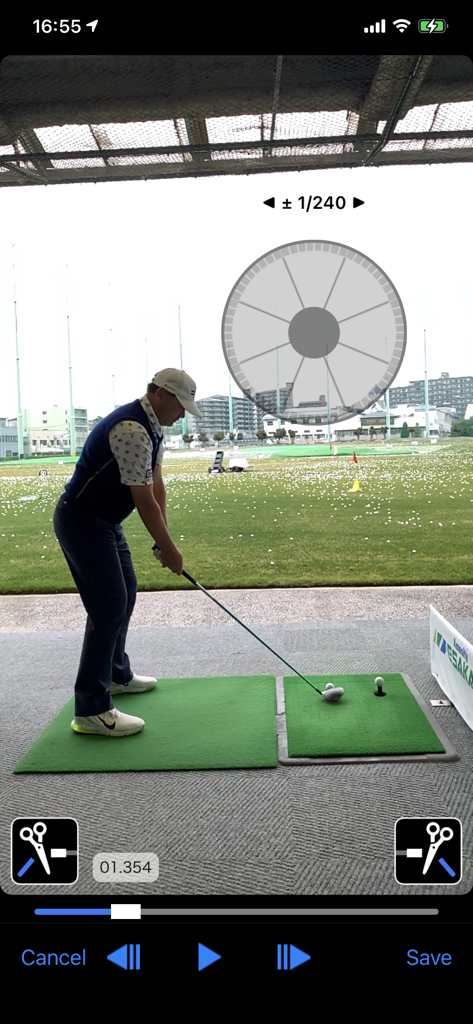 Golf Swing Check - Slow Movie - A golfer in address position at a driving range with an overlay of a jog shuttle for frame-by-frame swing analysis