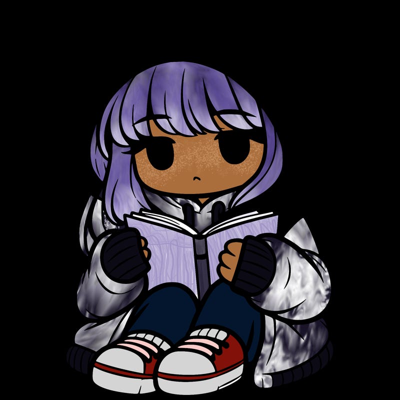 girl in oversized hoodie reading a book