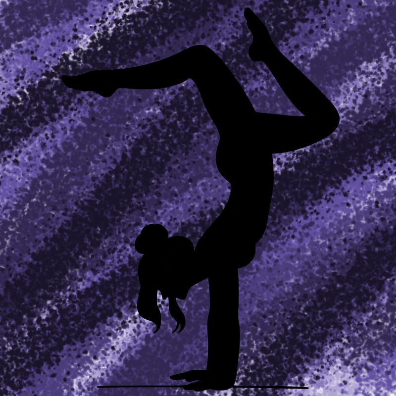 a woman doing a handstand