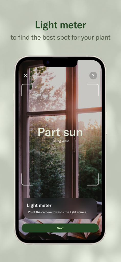 Planta: Plant & Garden Care - Smartphone screen showing the Planta app light meter measuring sunlight through a window for indoor plants.