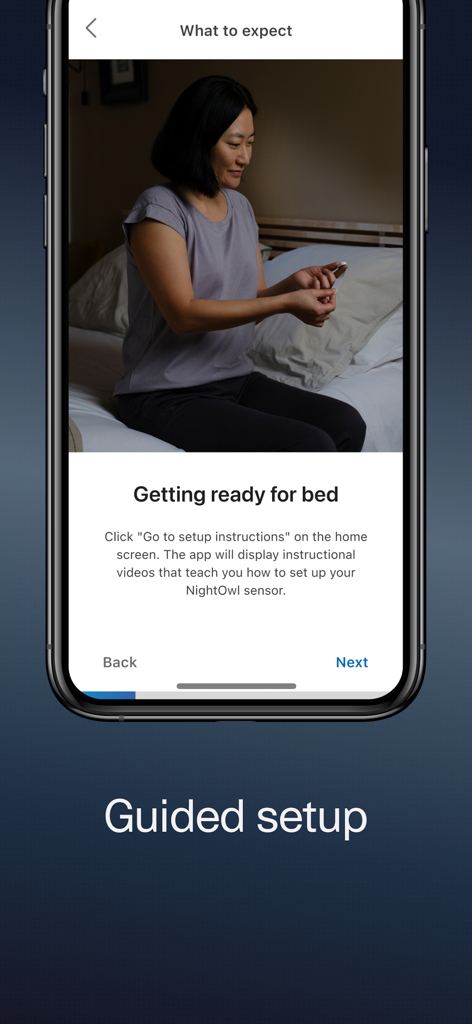 NightOwl Companion - Guided setup screen in the NightOwl Companion app showing a woman preparing a sensor for a sleep test.