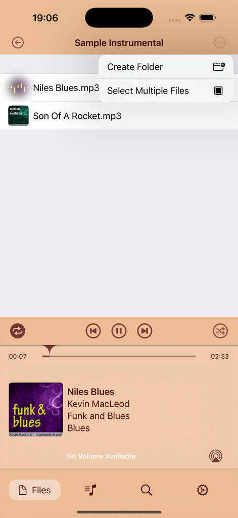 iMP3 music player interface showing a list of songs and a menu to create folders or select multiple files.