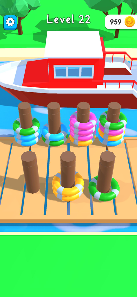 Gameplay of Hyper Boat level 22 showing a sorting puzzle with colorful life buoys on a dock.