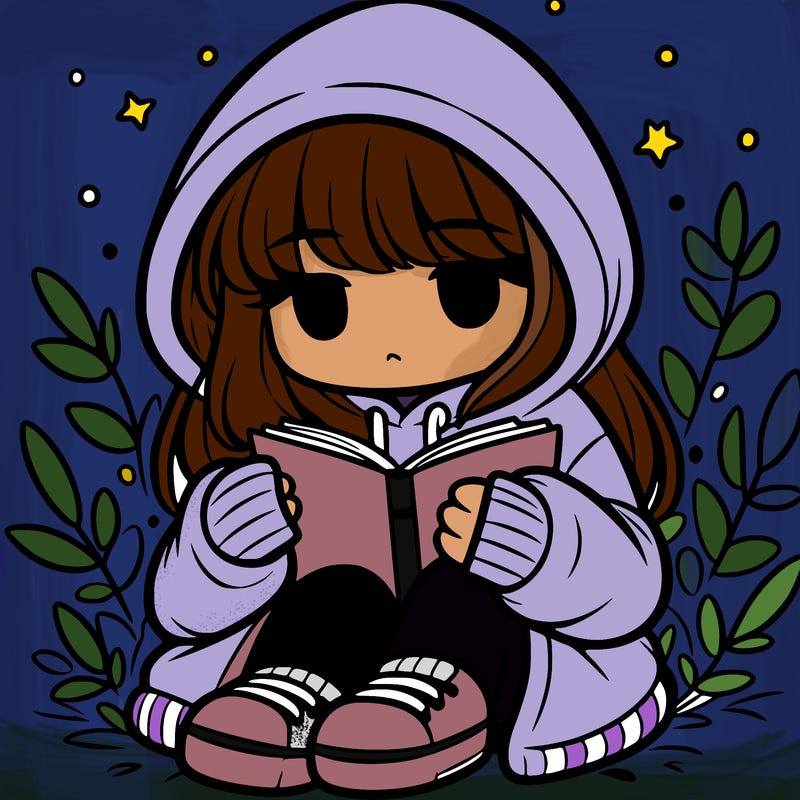 girl in oversized hoodie reading a book