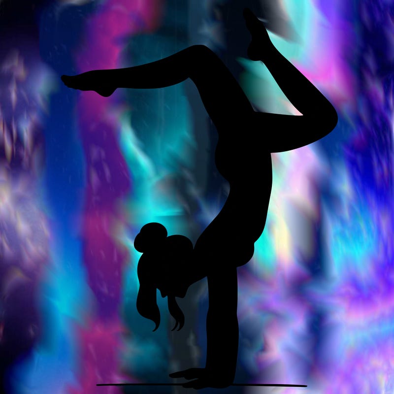 a woman doing a handstand