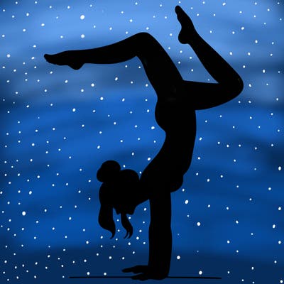 a woman doing a handstand