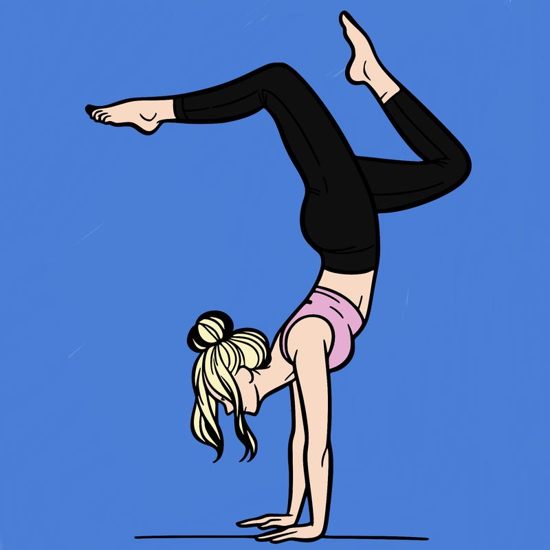 a woman doing a handstand