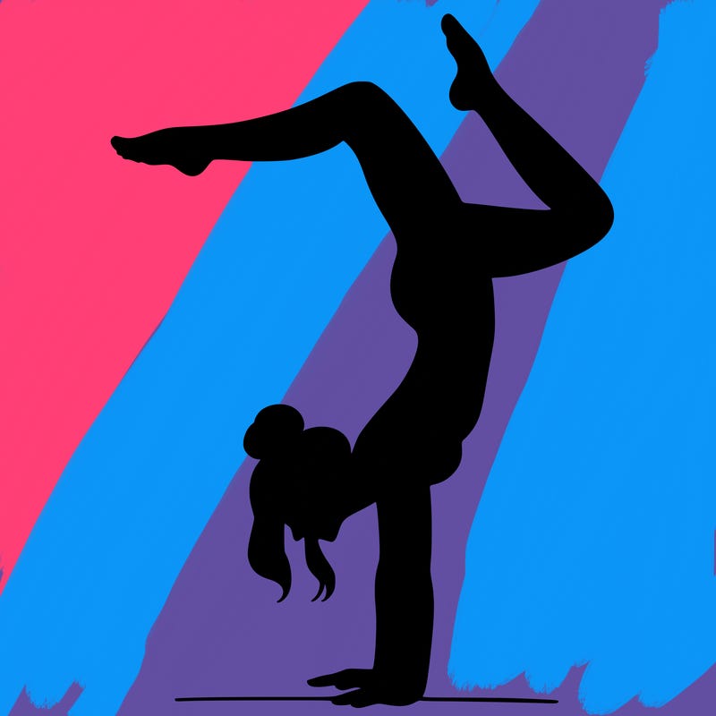 a woman doing a handstand