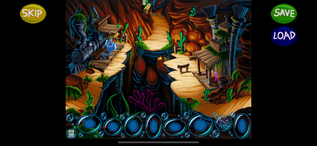 Underwater Wild West canyon scene in Freddi Fish 4 featuring buildings and a train