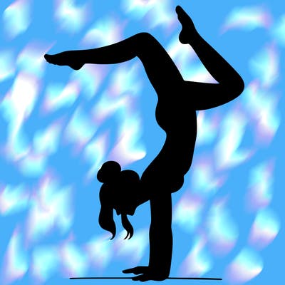a woman doing a handstand