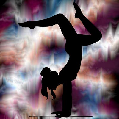 a woman doing a handstand