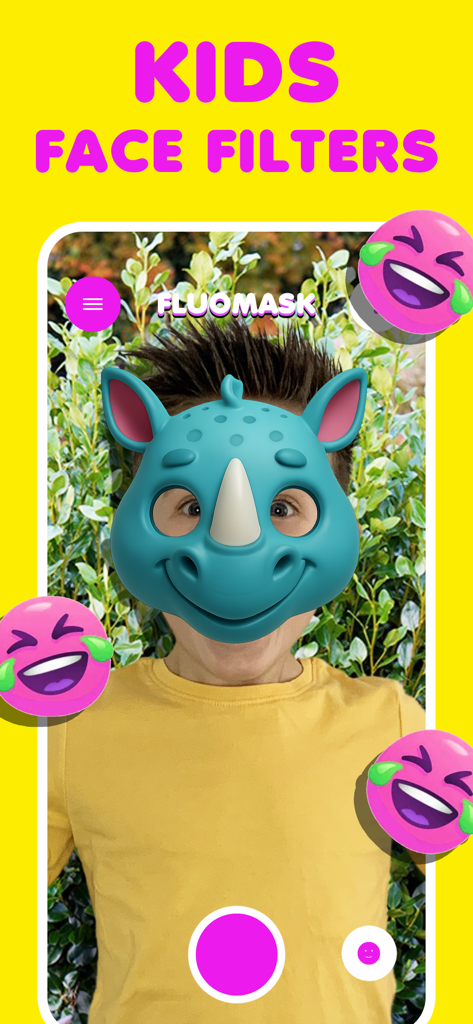 Face filter kids game FluoMask - A child using the FluoMask app with a blue rhinoceros face filter and laughing emojis
