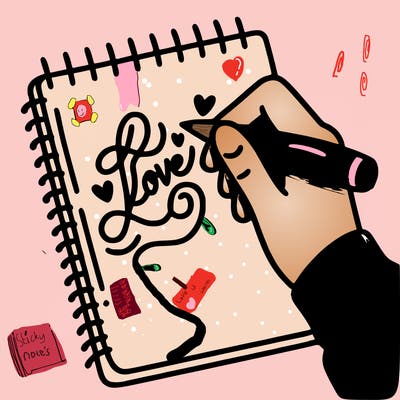 a hand writing “love” in calligraphy on a notebook