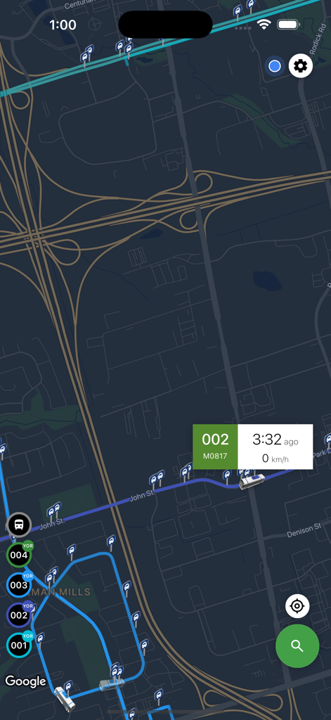 A real-time transit map showing bus routes and live vehicle locations in dark mode.