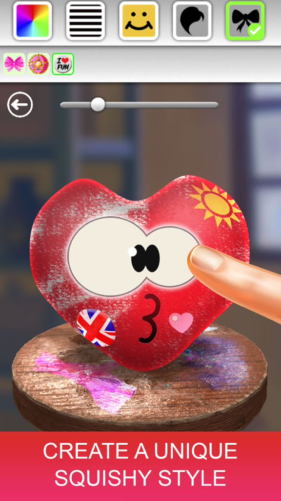 Make Super Squishy - Simulator - A hand customizing a red heart squishy toy with stickers in the app editor