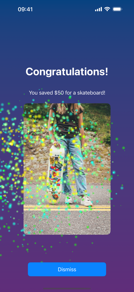 I Am Saving - A screen in the I Am Saving app congratulating a user for saving fifty dollars for a skateboard with a celebratory image and confetti.