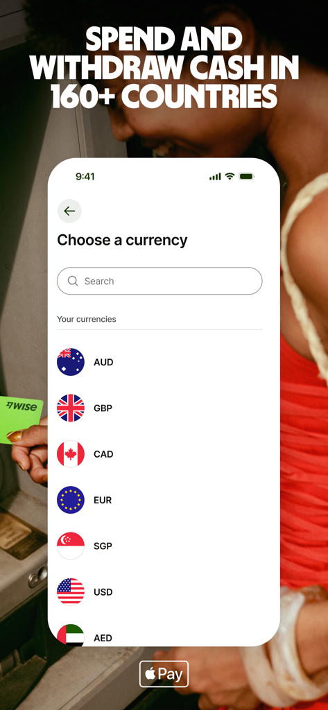 Wise app interface showing currency selection list for international spending with a background of a person using an ATM