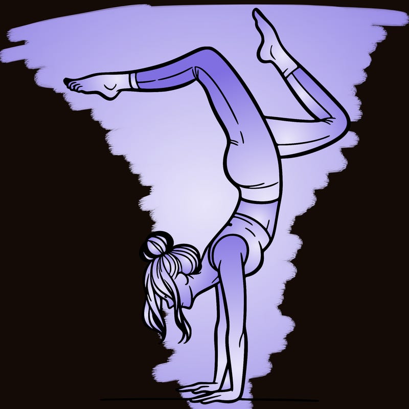 a woman doing a handstand