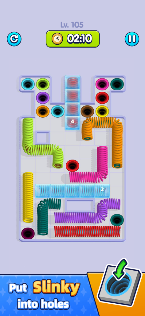 Gameplay screenshot of Slinky Go showing colorful springs being sorted into matching holes