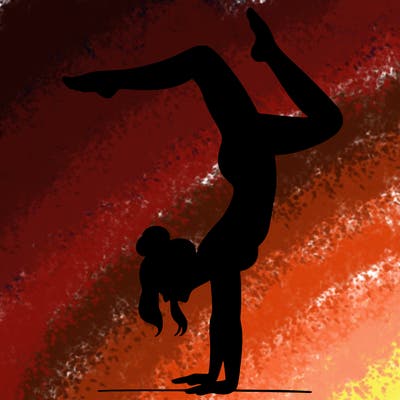 a woman doing a handstand