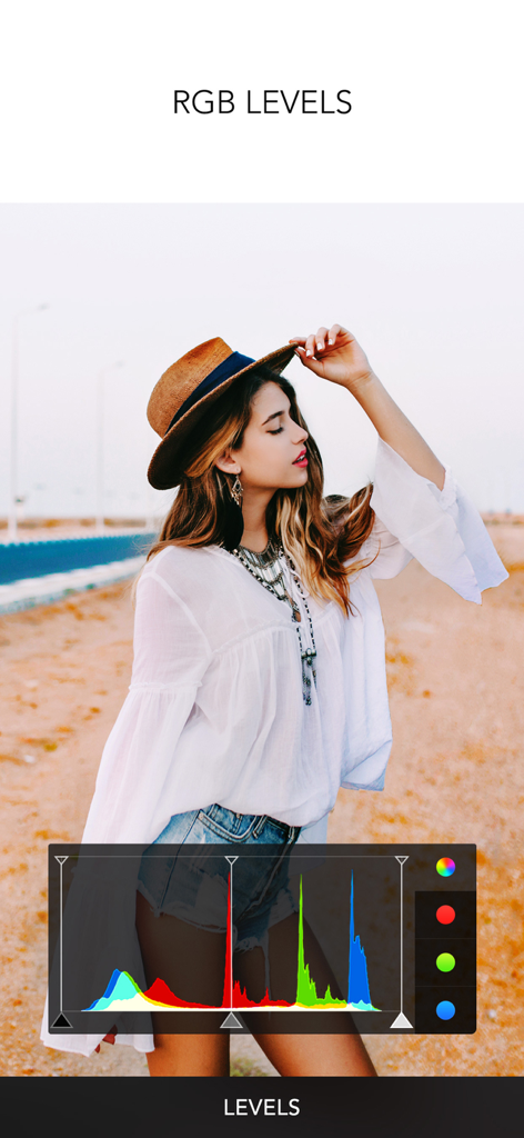 A woman wearing a hat edited with professional RGB levels tools in the PICSPLAY Classic app