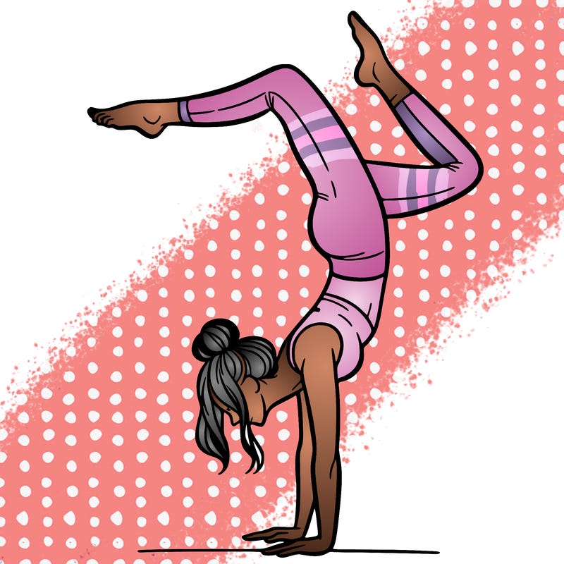 a woman doing a handstand