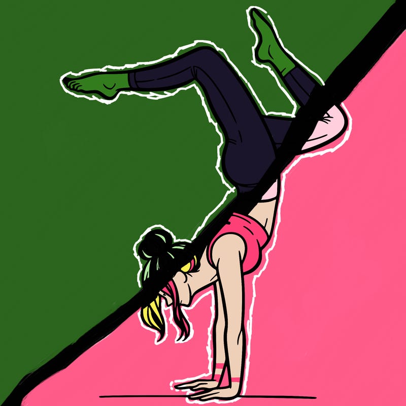 a woman doing a handstand