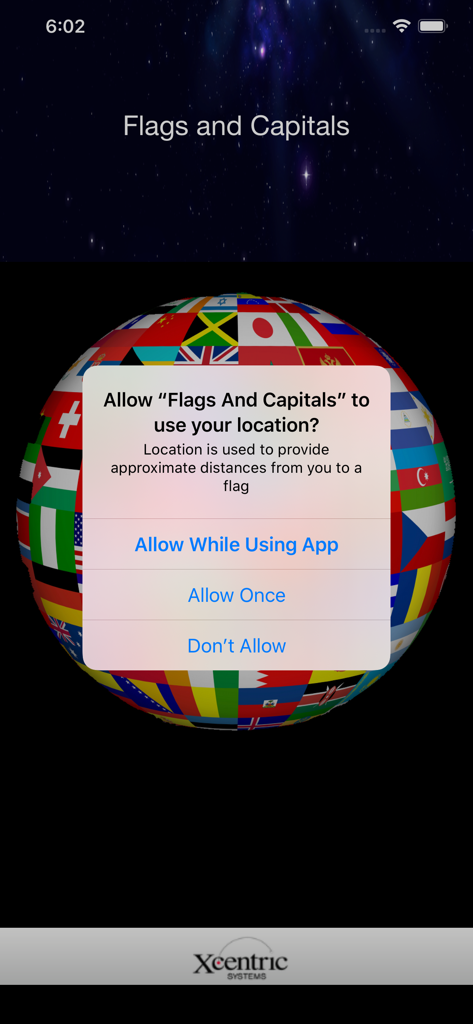 Flags and Capitals - Flags and Capitals app screenshot showing a system location permission request over a 3D globe made of international flags.