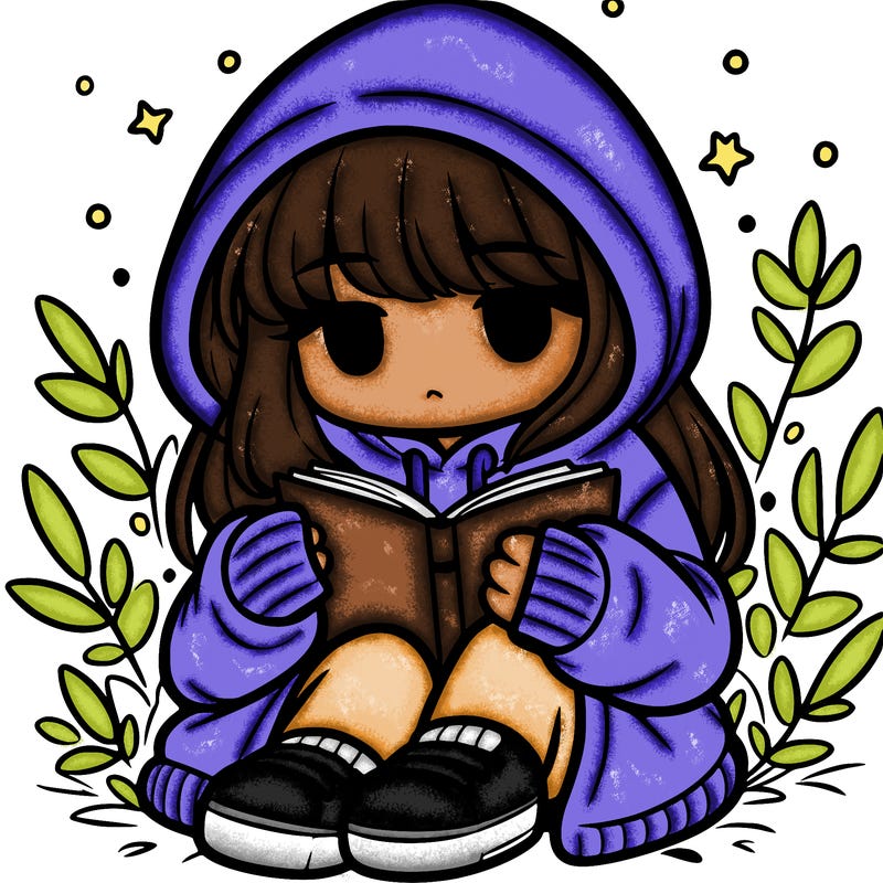 girl in oversized hoodie reading a book